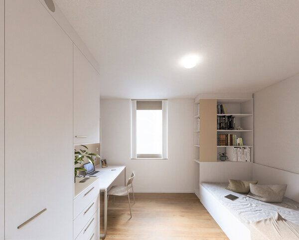 Ein modernes Studierendenzimmer mit Schreibtisch, Bett und Regalen, hell und lichtdurchflutet im Studierendenwohnheim der HOK. | © Architekten Adamer°Ramsauer 